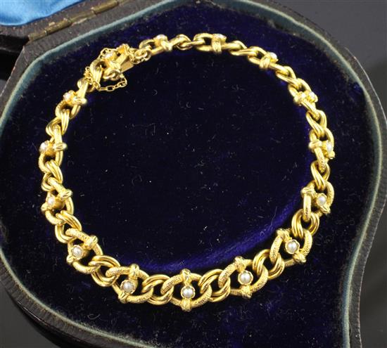 An early 20th century 18ct gold and seed pearl set chain link bracelet, 6.5in.